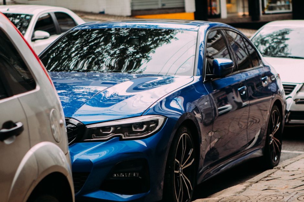 Shiny car parked street - Car insurance for older cars in South Africa