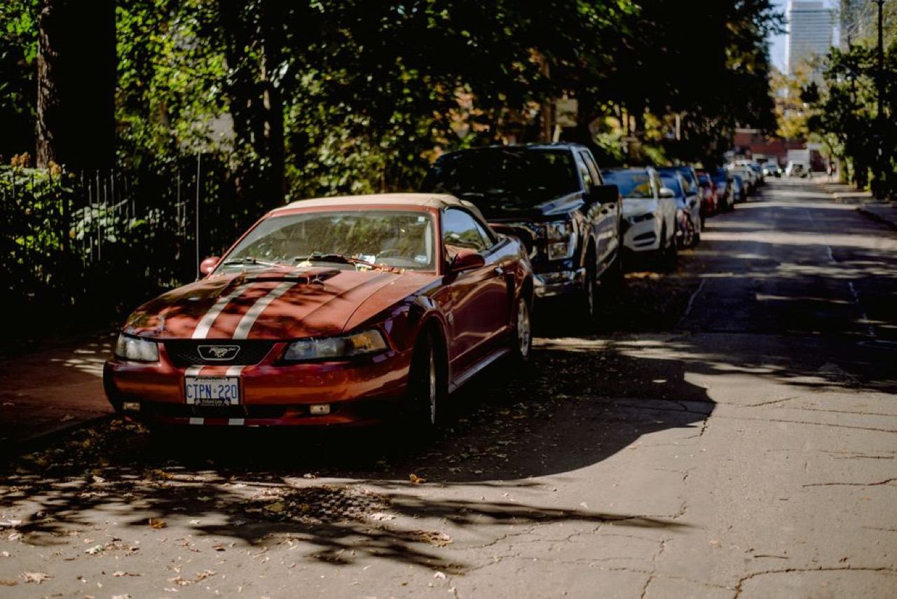 Shiny car parked street - How much does car insurance cost in South Africa?