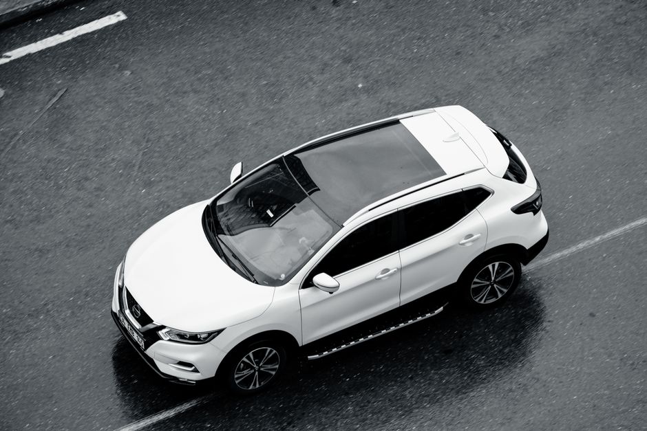 Modern car on road - Rental car insurance and car hire excess cover