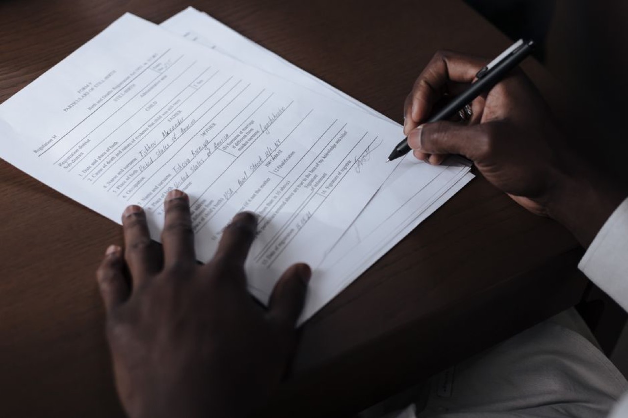 Person filling form - How to Appeal a Rejected Car Insurance Claim (with Letter)