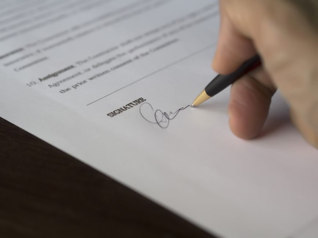 Signing paperwork close up - Car Insurance Cancellation Letter Template