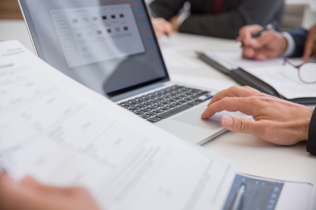 Laptop and documents desk - Complaint Letter to Your Insurer and OSTI Escalation Template