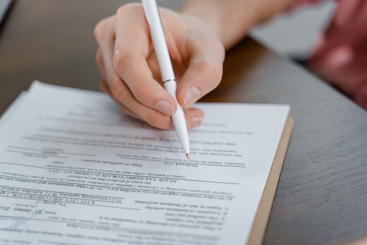 Person filling form - Roadworthy and Pre-Purchase Used Car Checklist